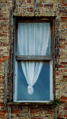 old wooden window with brick wall 