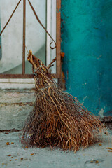 Handcrafted Broom Leaning Against the Wall