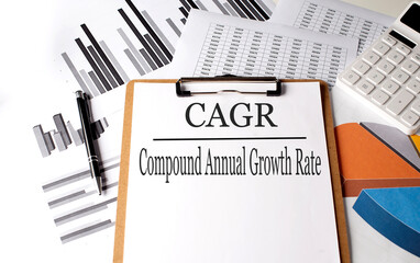 Paper on clipboard with CAGR on a chart background