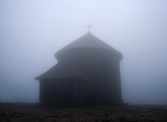 Mysterious chapel on Mount Śnieżka in the fog