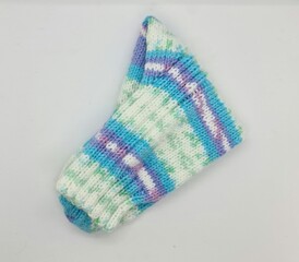 A knitted sock on a white background