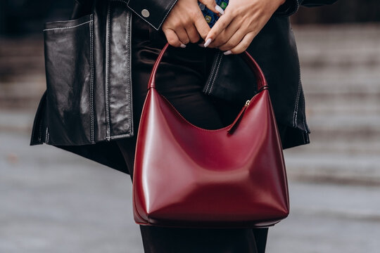Paris, France - October, 3, 2021: woman wears handbag Mansur Gavriel leather shoulder bag, street style details.
