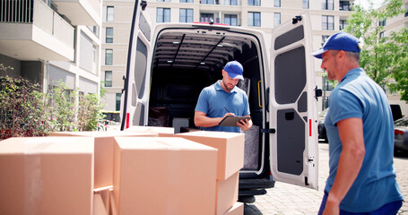 Mover Workers Near House Relocation Van