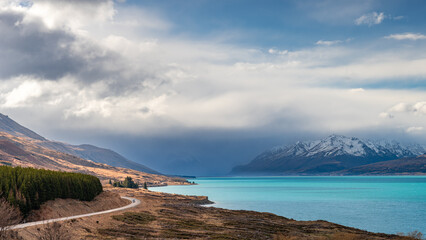 Scenic view at Peters Lookout, Mount Cook Road alongside Lake Pukaki with snow capped Southern Alps...