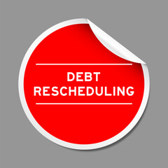 Red color peel sticker label with word debt rescheduling on gray background