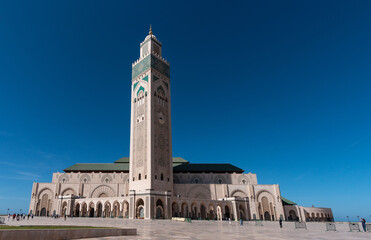 Exterior of the famous Hassan II Mosque at the coast of Casablanca in Morocco - obrazy, fototapety, plakaty