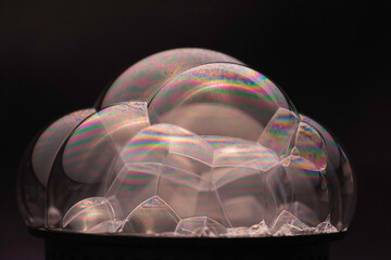 Soap bubbles with colors looking like rivers and oceans on earth surface