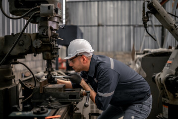 Fototapeta na wymiar Robotic technicians perform regular maintenance by inspecting, testing, and repairing machinery and engines to ensure they stay in standard condition.Recording and reporting damaged, incomplete items
