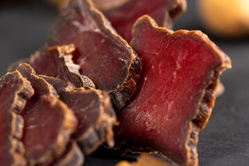 dried red beef meat on the kitchen table