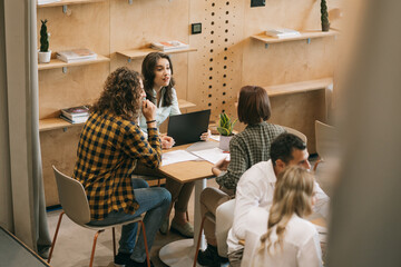 Brunette girl confronting her female colleague at work