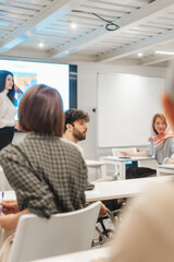 Male employee in wheelchair listening to his colleague sharing a same situation that he has been through