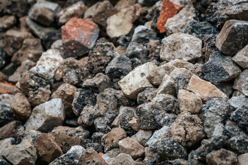 Textured City Pavement with Stone, Gravel, and Pebbles on Concrete Road