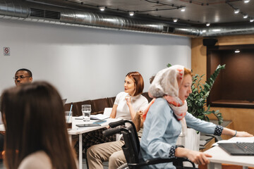 Group of businesspeople exchanging ideas while working at the office