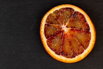 sliced orange with yellow-red juicy flesh