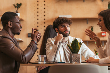 Three work friends talking