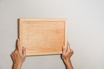 person holding a blank board