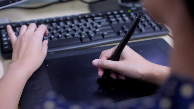 Women Graphic Designer working on a tablet