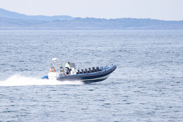Recreational boat (Rib) in motion on  Vegafjorden, Nordland county, Norway, Europe