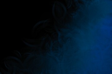 Black background with blue smudges evoking chalk strokes