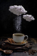 a cup of coffee, dripping sugae and cloud in conceptual photography