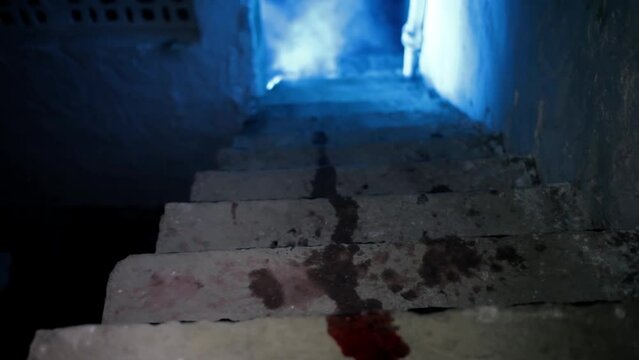 Cinematic creative shot of red blood on stairs with gothic dark lighting and smoke. HD footage 24 fps