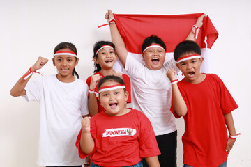Cheerful Indonesian kids celebrate Indonesia independence day