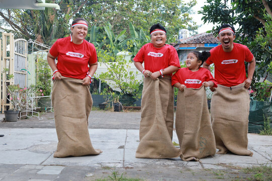 Indonesian family celebrate Indonesia independence day with outdoor contest