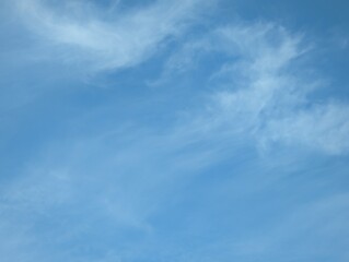 Blue sky with light cirrus cloud