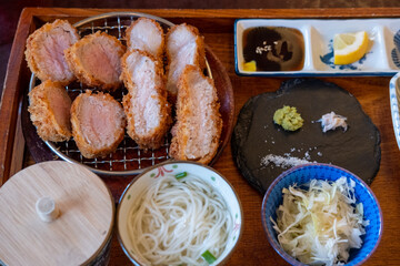 Sous Vide tonkatsu, Fried Pork with side dishes serve on plate in restaurant