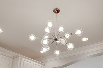 Contemporary modern light fixture with glass round bulbs and shade pendant lighting interior design brass silver accents
