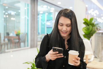 Business people holding coffee cup and smartphone