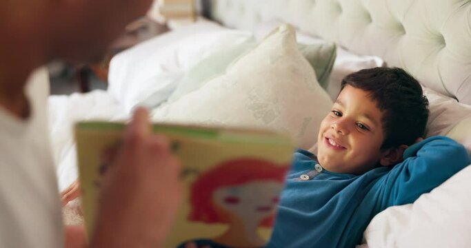 Dad, son and bed with book, story and reading together with learning, knowledge and happy in family home. Father, male kid and teaching at bedtime, care and love with bonding, bedroom and listening