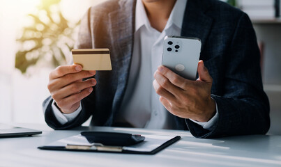 Businesswoman hands holding cradit card and using credit card online shopping. Online shopping concept