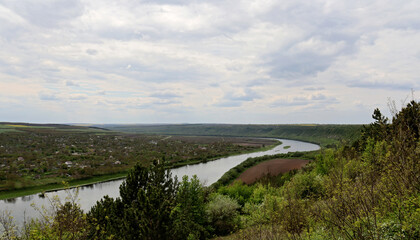 Scenic bird's eye view of the village, river and houses on the other side of the river