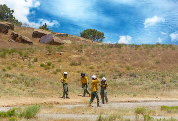 Helitack crew configures the ship for bucket operations