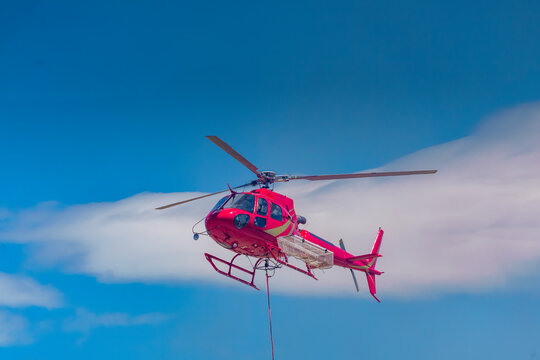 Helicopter and crew fighting a wildfire