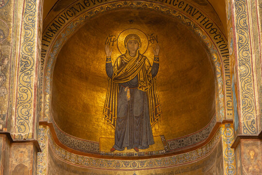 Ukraine, Kyiv - 05 25 2023: St. Sophia church interior. Golden mosaic of Virgin Mary. Ancient christian cathedral. Saint Sophia fresco. Ukrainian religious architecture. Medieval altar decoration. 