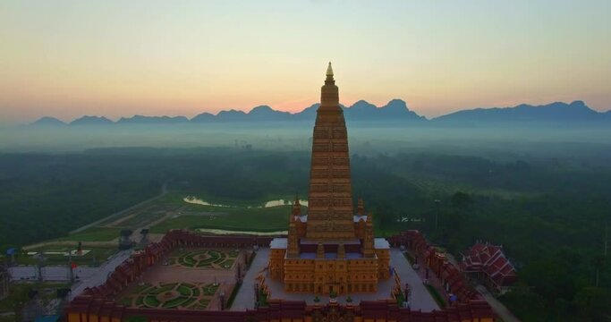 ..Aerial view the high yellow pagoda in wat Bang Tong temple. Nanuea,Krabi Thailand..Wat Bang Tong is the most beautiful temple in south of Thailand..