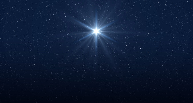 Star of Jesus with rays of light. Christmas star of the Nativity of Bethlehem, Nativity of Jesus Christ. Background of the beautiful starry sky and bright star.