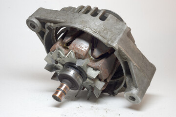 car old alternator details. metal fan under roller bearing. slip rings. rotor assembly rusty iron...