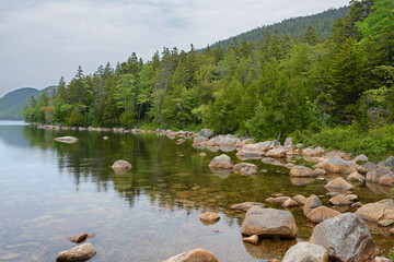 Shore of Jordan Pond, one of park's most pristine lakes, with outstanding surrounding mountain scenery. Acadia National Park, Maine, United States