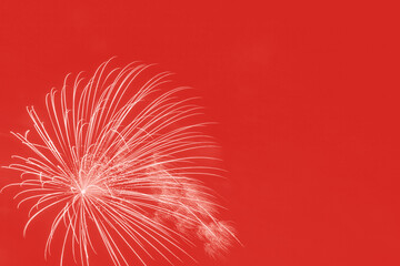 holiday fireworks against red background