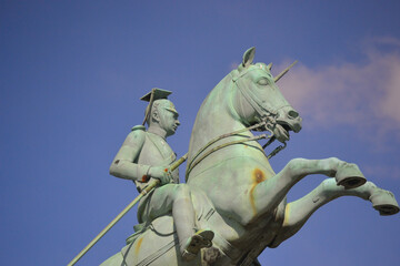 A statue that is mounted on a horse