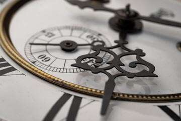 Vintage Clock with Hands.Close up view on clock face of a historical watches with golden frame