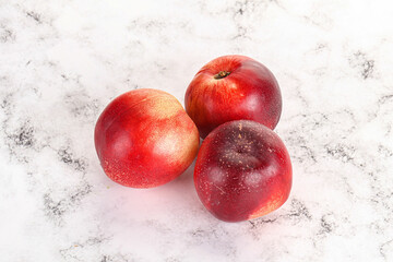 Ripe sweet juicy nectarines heap