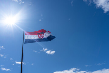 Flag of Croatia against sunny blue sky