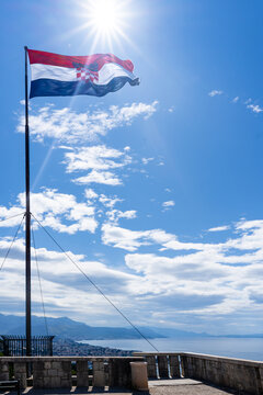 Flag of Croatia against sunny blue sky