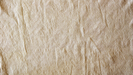 Linen fabric background of warm beige color, top view