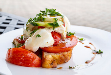Plate of Bocconcini Salad Served in a Restaurant