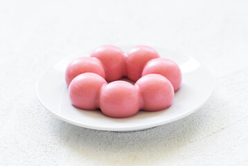 Strawberry truffle. Strawberry cream dessert on a plate. White background